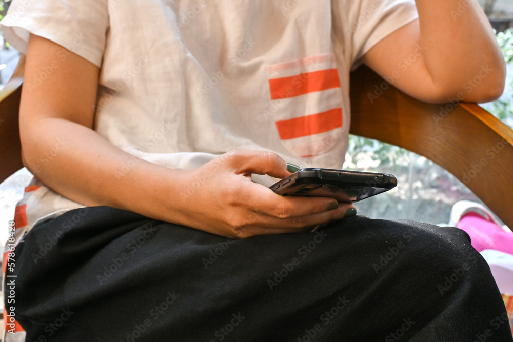 Mockup image of woman's hands holding smart mobile phone with blank screen coffee cup in cafe. Enjoy her peaceful relaxing time, Self care time mindfulness lifestyle. Mockup image of woman's hands holding smart mobile phone with blank screen coffee cup in cafe. Enjoy her peaceful relaxing time, Self care time mindfulness lifestyle.