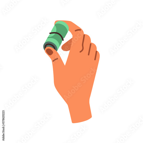 Hand holding money, rolled dollar banknotes. Financial concept. Squeezing cas...
