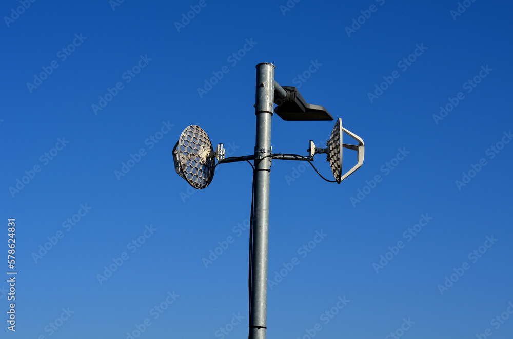 toll gate with antennas with perforated satellites transmitter and receiver. reads data from toll boxes in trucks and lorries . pays for using the highway, road and exceeding the speed limit. radar toll gate with antennas with perforated satellites transmitter and receiver. reads data from toll boxes in trucks and lorries . pays for using the highway, road and exceeding the speed limit. radar