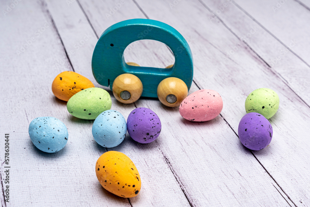 Colorful Easter eggs and children's wooden toy gift