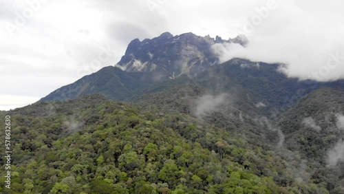 Bird eye view of dense fog over tropical green mountains 