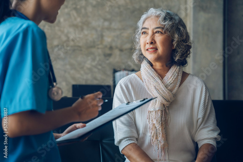 Elderly health checkups with a physician or psychiatrist who works with patients who are consulted about female or psychiatric diagnosis in a medical clinic or hospital mental health service. photo