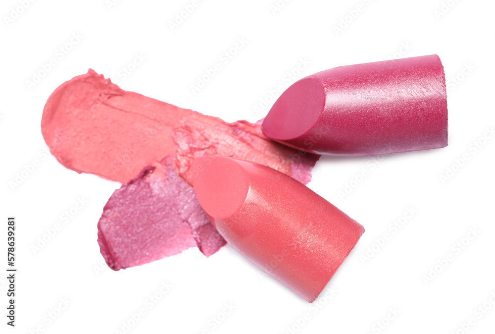 Different bright lipsticks and smears on white background