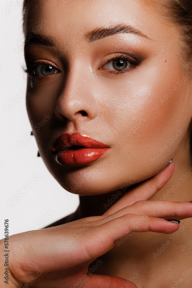 Beautiful face, head and shoulders of blond woman model, touching face, healthy glowing facial skin, standing over white background. Advertising healthy or beauty cosmetic products Beautiful face, head and shoulders of blond woman model, touching face, healthy glowing facial skin, standing over white background. Advertising healthy or beauty cosmetic products