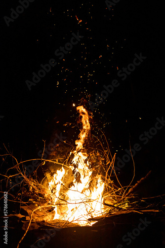 Fire flames at night. Bonfire on black background.