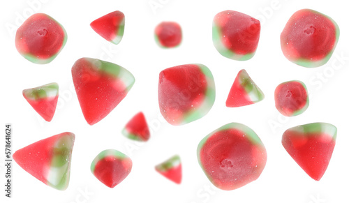 Tasty watermelon gummy candies falling on white background. Jelly sweet