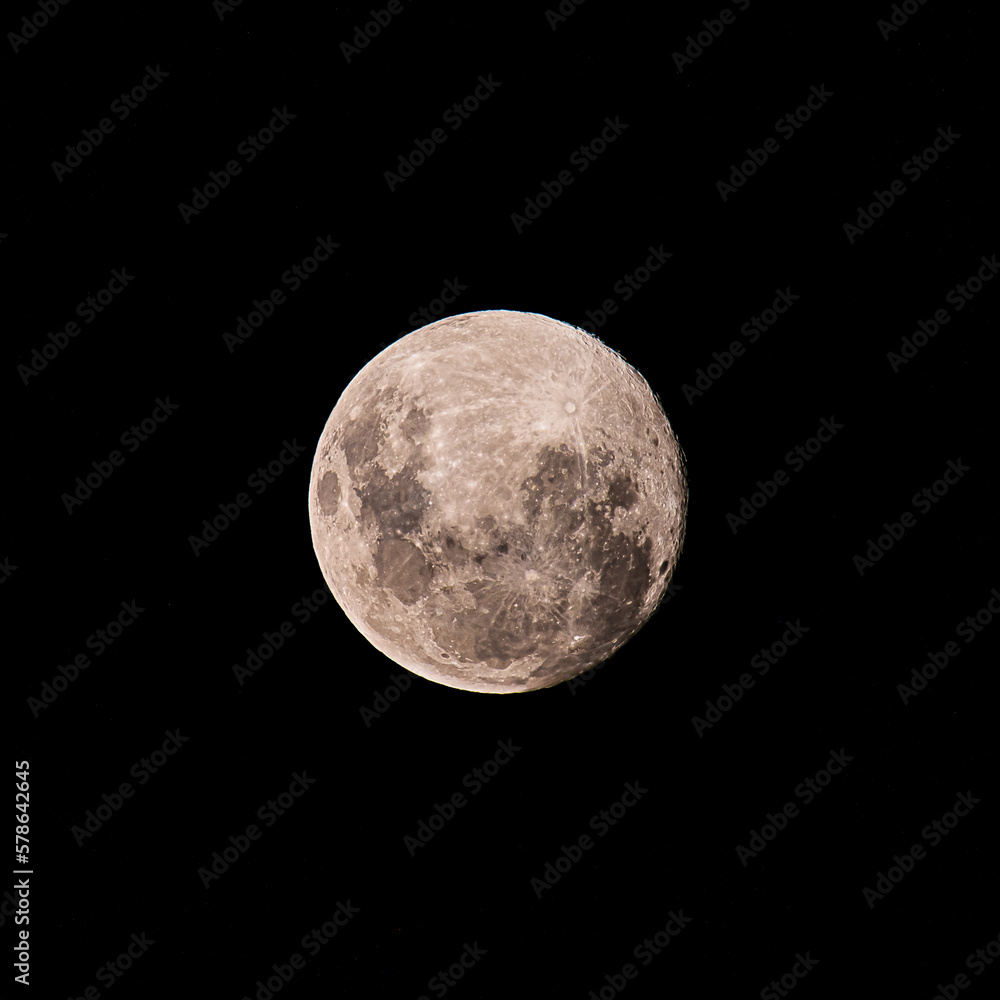 Earth's moon at 98 percent full on a hot, dark and smoky night sky Earth's moon at 98 percent full on a hot, dark and smoky night sky