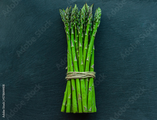 asparagus green on black background farm product healthy food diet vegetables vegetarian ingredients for cooking