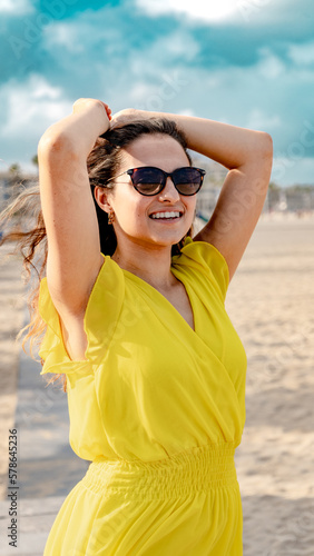 woman in yellow dress on beach