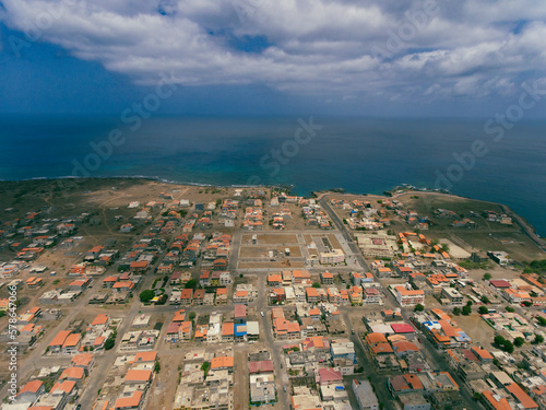 Aerial photos of Tarrafal in Santiago Island, Cabo Verde showcase the stunning beaches and clear waters of this idyllic coastal town, as well as its colorful buildings, charming streets