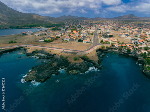 Aerial photos of Tarrafal in Santiago Island, Cabo Verde showcase the stunning beaches and clear waters of this idyllic coastal town, as well as its colorful buildings, charming streets