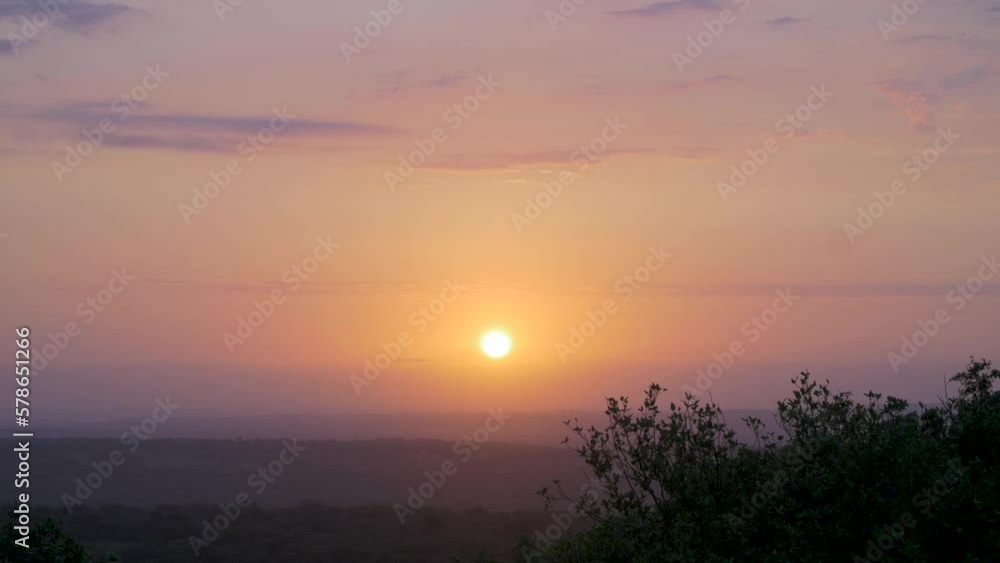 General shot of the African sun through the clouds at sunset. General shot of the African sun through the clouds at sunset.
