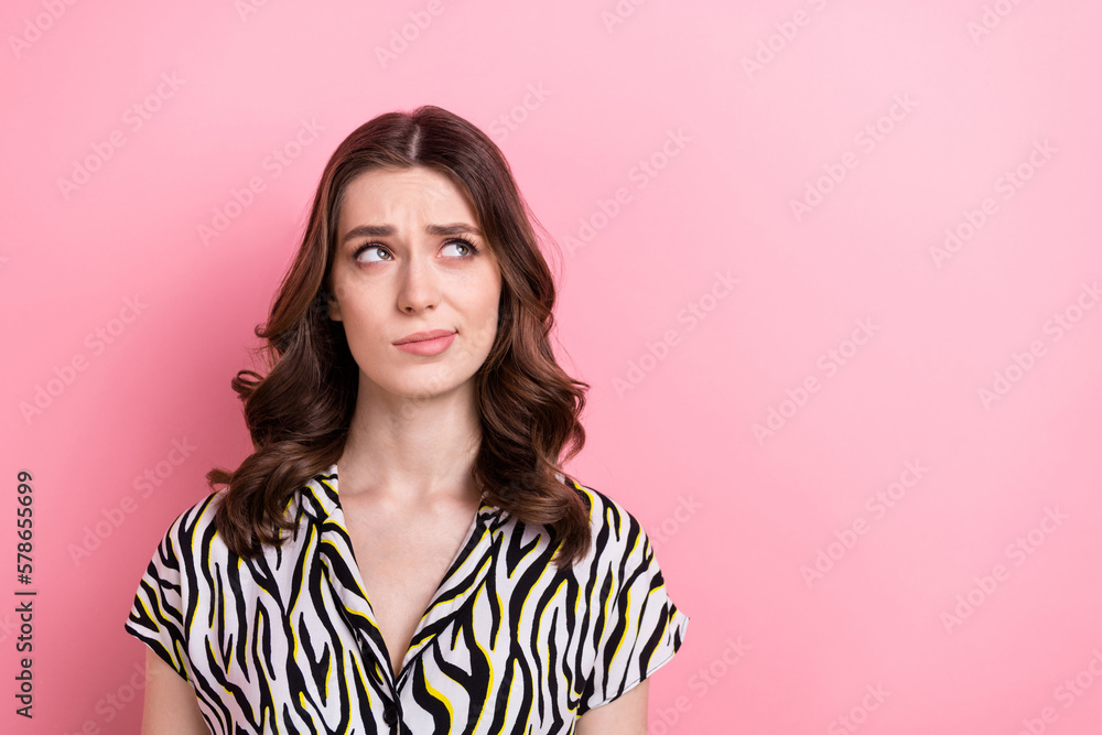 Portrait of young ponder girl brown wavy hairstyle hmm uncertain choose proposition look empty space dilemma isolated on pink color background Portrait of young ponder girl brown wavy hairstyle hmm uncertain choose proposition look empty space dilemma isolated on pink color background