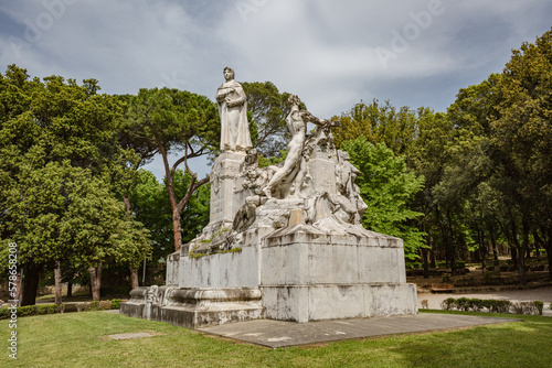 TUSCANY, AREZZO – May, 2022: Monument to Francesco Petrarca on the lawn walk inside of Public park in Arezzo. Built in 1928, it is the largest marble complex dedicated to Francesco Petrarca photo