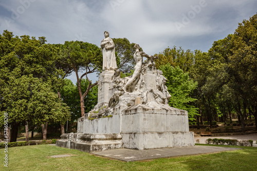 TUSCANY, AREZZO – May, 2022: Monument to Francesco Petrarca on the lawn walk inside of Public park in Arezzo. Built in 1928, it is the largest marble complex dedicated to Francesco Petrarca