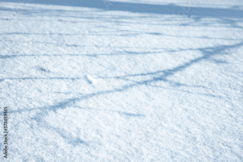 Snowdrift surface on a sunny summer day with shadows © evannovostro