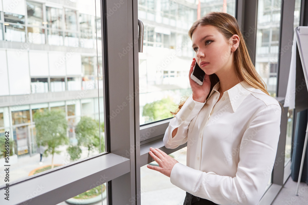 Young businesswoman talking on the cellphone Young businesswoman talking on the cellphone