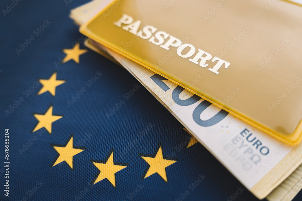 Fototapeta premium passport and money of the European Union on EU flag