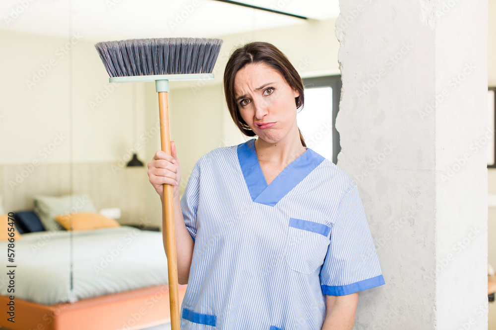 young pretty woman feeling sad and whiney with an unhappy look and crying. housekeeper concept young pretty woman feeling sad and whiney with an unhappy look and crying. housekeeper concept