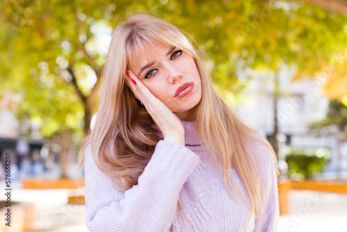 фотографія young pretty woman feeling bored, frustrated and sleepy after a tiresome, dull a