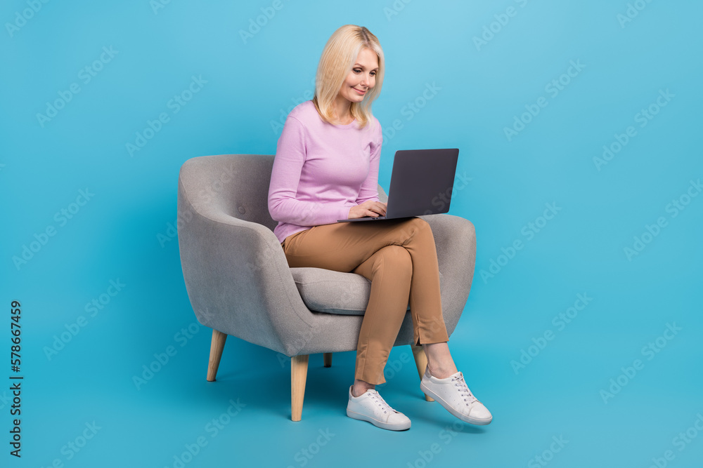 Photo of charming adorable lady office manager wear trendy clothes write news use modern netbook macbook isolated on blue color background Photo of charming adorable lady office manager wear trendy clothes write news use modern netbook macbook isolated on blue color background