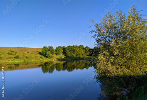 view of a calm lake in summer in Ukraine