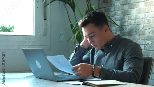 Confused frustrated young man reading letter, debt notification, bad financial report, money problem, money problem, upset student receiving bad news, unsuccessful exam or test results
