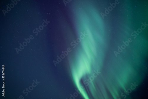 Aurora borealis and stars sharing half the sky