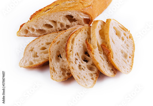 Sliced traditional french baguette on white