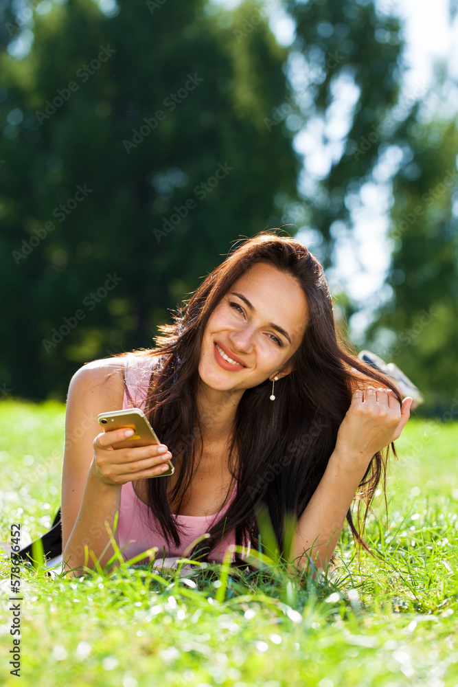Happy beautiful brunette girl calling by phone Happy beautiful brunette girl calling by phone