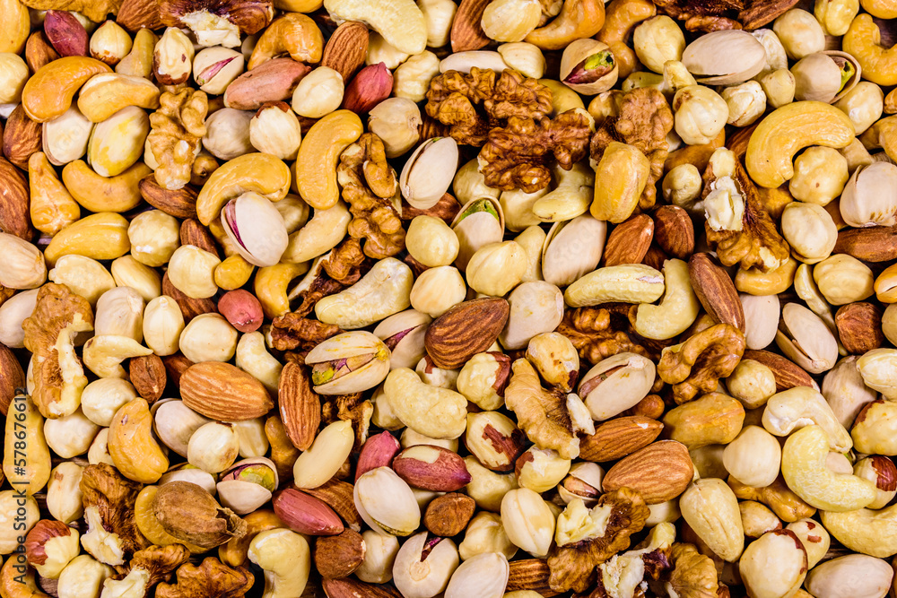 Background of the various nuts (almond, cashew, hazelnut, pistachio, walnut). Vegetarian meal. Healthy eating concept Background of the various nuts (almond, cashew, hazelnut, pistachio, walnut). Vegetarian meal. Healthy eating concept
