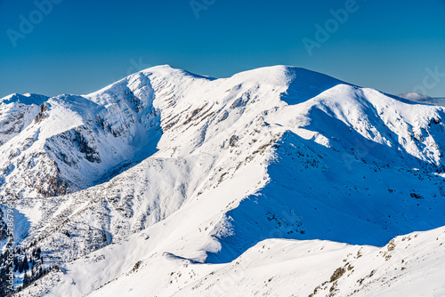 Fototapeta Naklejka Na Ścianę i Meble -  Poland 2022. Beautiful view on the snow Tatry.
Zakopane, Giewont, Kasprowy Wierch, Swinica, Rysy, Kresanica