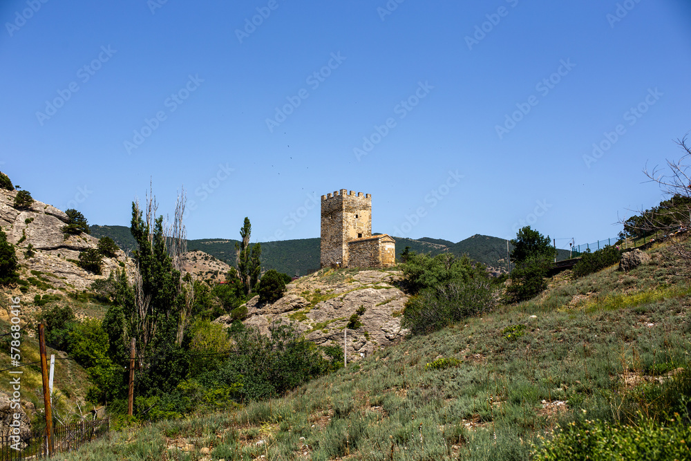  Beautiful summer landscape - view of the mountains and the ancient fortress
