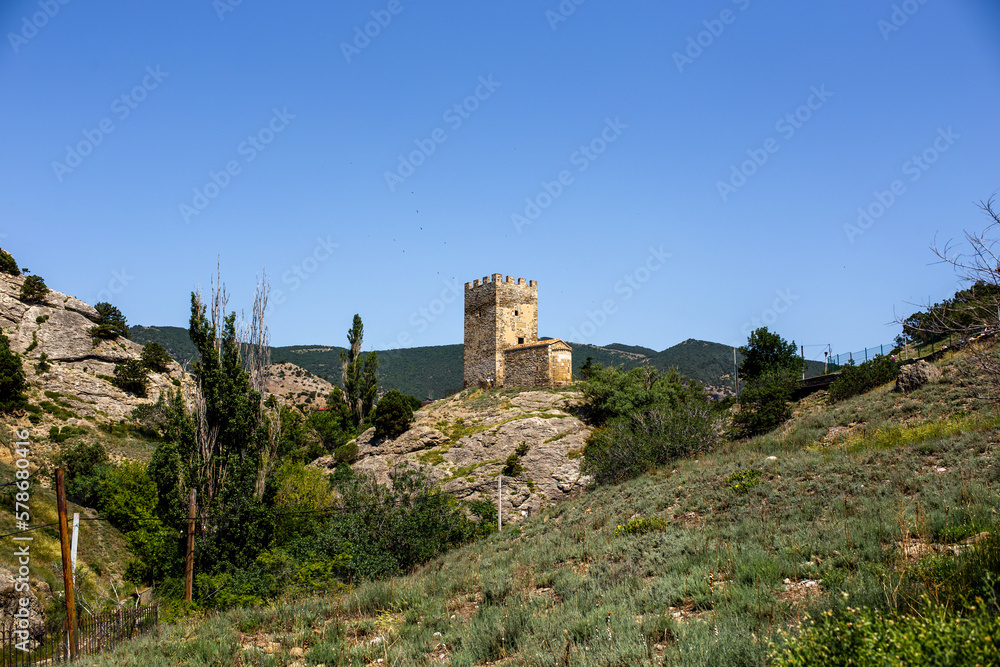 Beautiful summer landscape - view of the mountains and the ancient fortress Beautiful summer landscape - view of the mountains and the ancient fortress