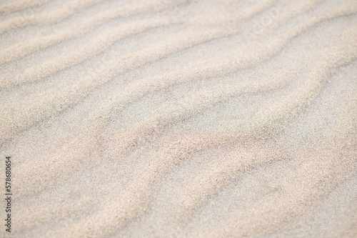 Fine beach sand in the summer sun, pattern, background