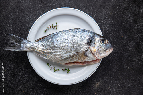 sea bream fresh fish seafood raw ready to cook healthy meal food snack on the table copy space food background rustic top view pescatarian diet