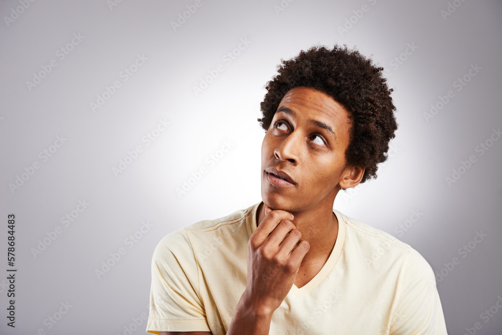 Fototapeta premium Be your own inspiration. a young man looking thoughtful against a gray background.