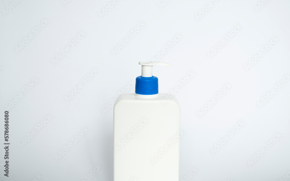 White unbranded plastic dispenser pump bottle on white background. Cosmetic package mockup, liquid soap flacon, hand sanitizer without label, shampoo organic spa, shower gel. White unbranded plastic dispenser pump bottle on white background. Cosmetic package mockup, liquid soap flacon, hand sanitizer without label, shampoo organic spa, shower gel.