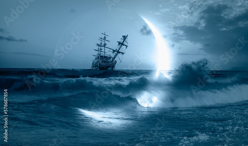 Sailing old ship in a storm sea with crescent moon stormy clouds in the background  © muratart
