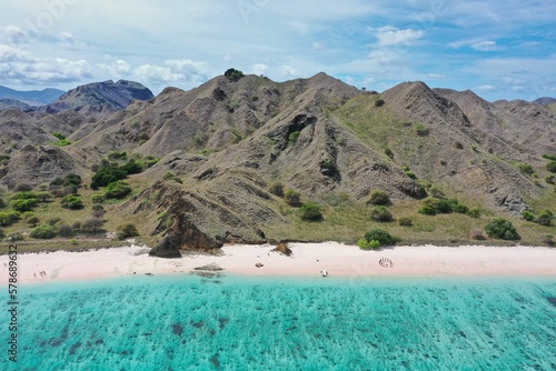 Paradise panoramic bird's eye view of Komodo National Park on Flores with turquoise sea, Pink Beach and hills.