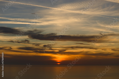 beautiful view of the sea in the evening with clouds and sutset photo