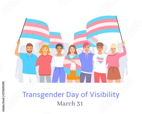 International Transgender Day of Visibility celebration. Trans Visibility March. Group of young happy men and women hugging each other and holding transgender pride flags on pride parade.