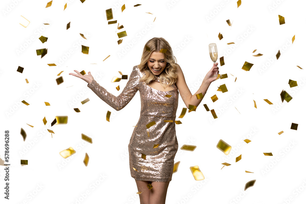 Happy New Year to you. Beautiful woman in sparkle dress standing under confetti rain with glass of champagne and smiling on transparent wall - obrazy, fototapety, plakaty 