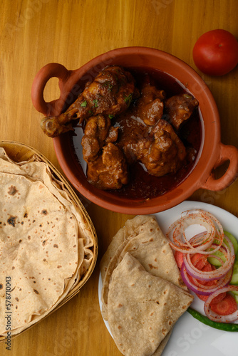 Saoji or savji chicken is a popular Indian food consists of poultry meat, served with chapati ,rice, salad  photo