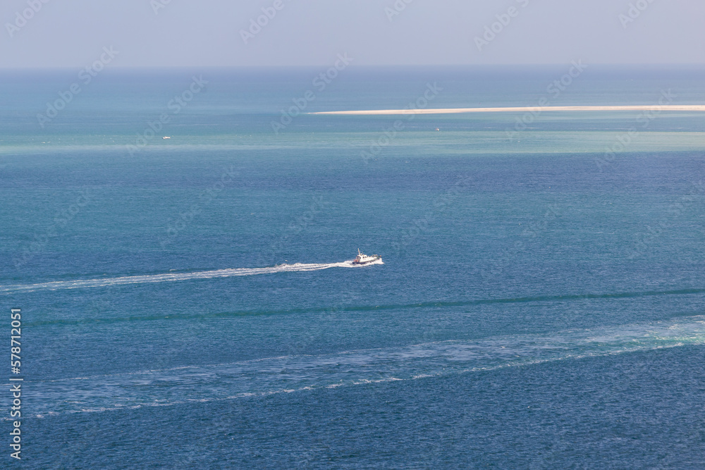 Boat on the ocean water, view from above