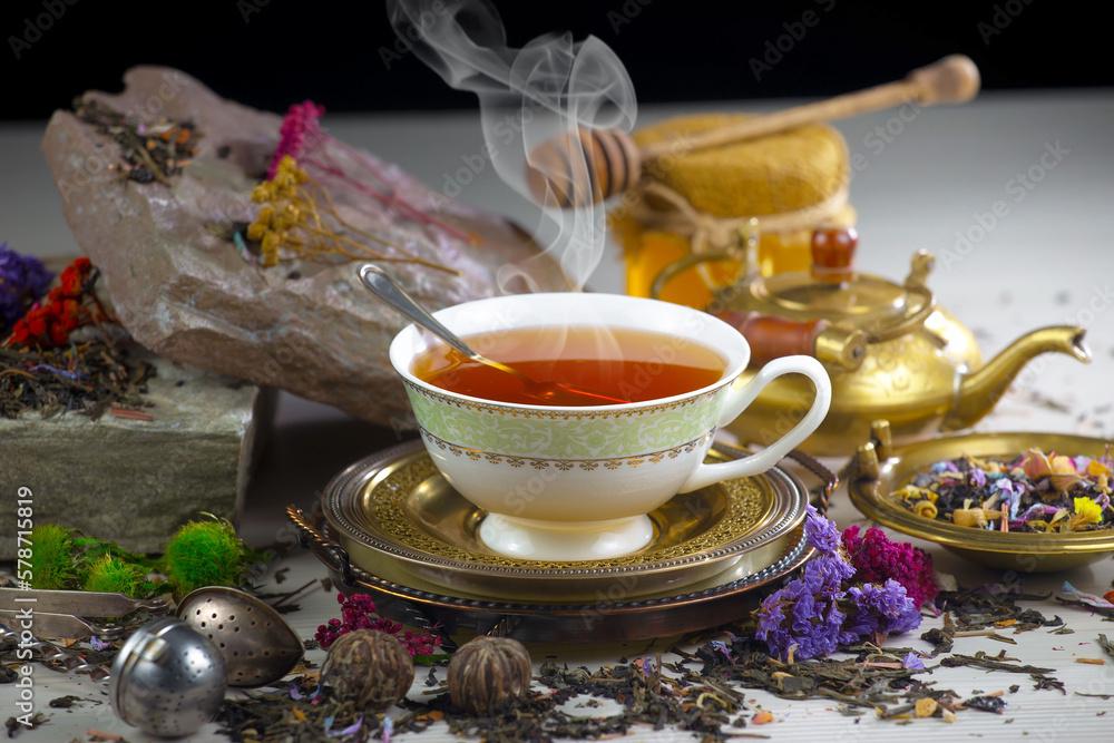 Hot sweet tea in a cup on old background Hot sweet tea in a cup on old background
