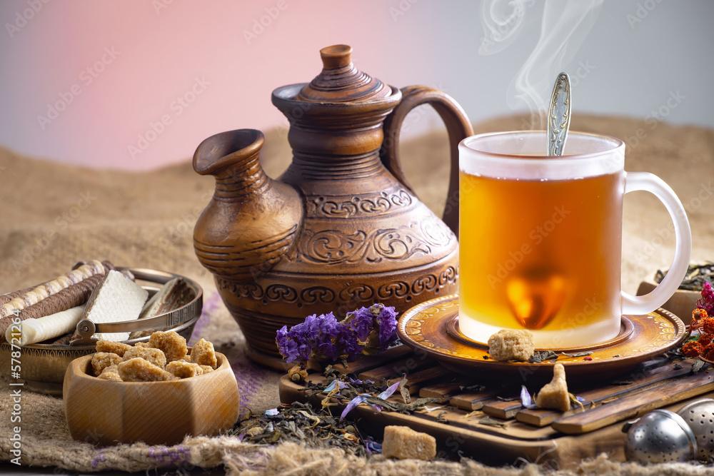 Fototapeta premium Sweet, hot tea with dessert, on an old background.