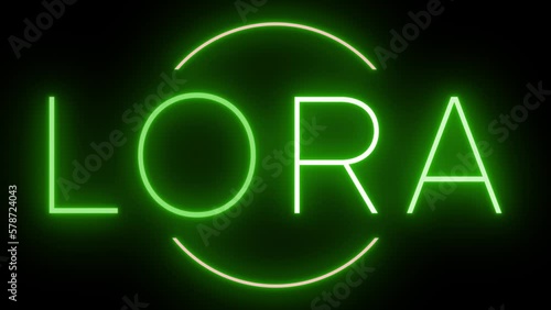 Flickering green retro style neon sign glowing against a black background photo