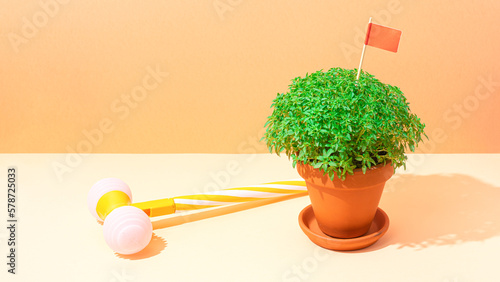 Manjerico plant and toy hammer against beige background. Traditional Summer festival in June San Juan, Portugal