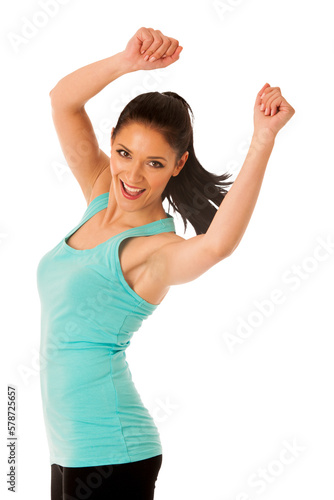 Happy fit and slim woman dancing and jumping isolated over white background
